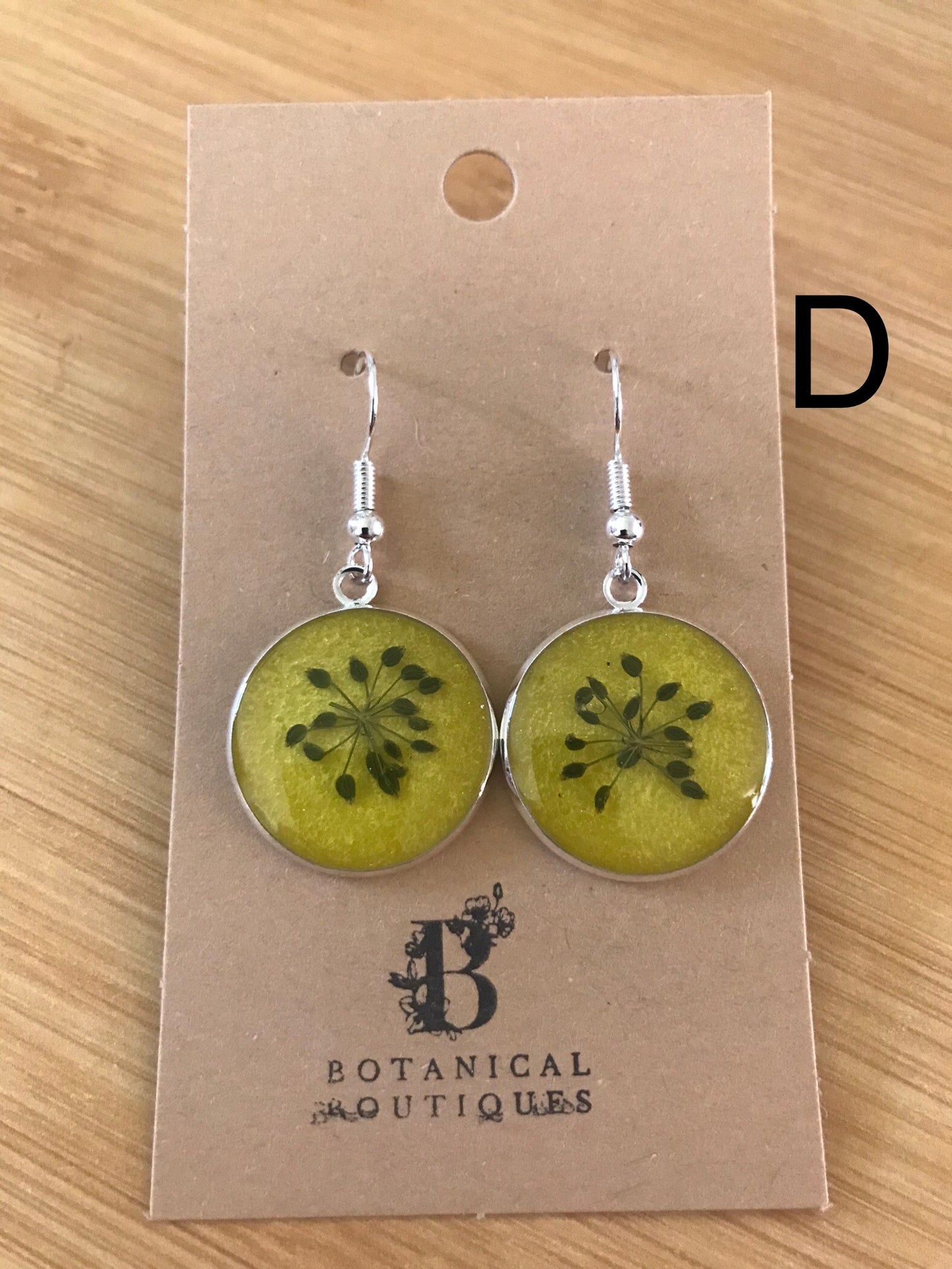 Coloured background dangling earrings