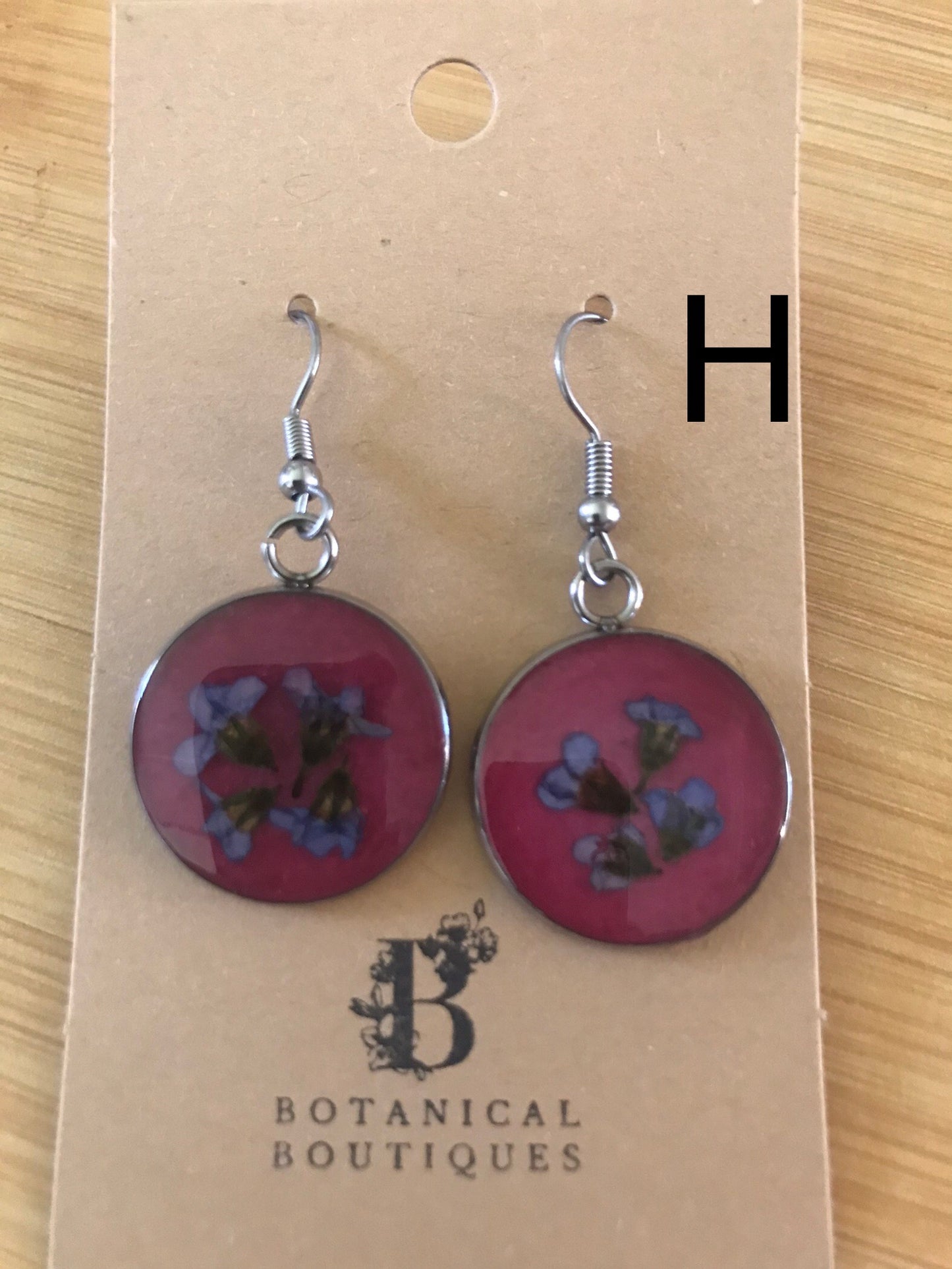 Coloured background dangling earrings