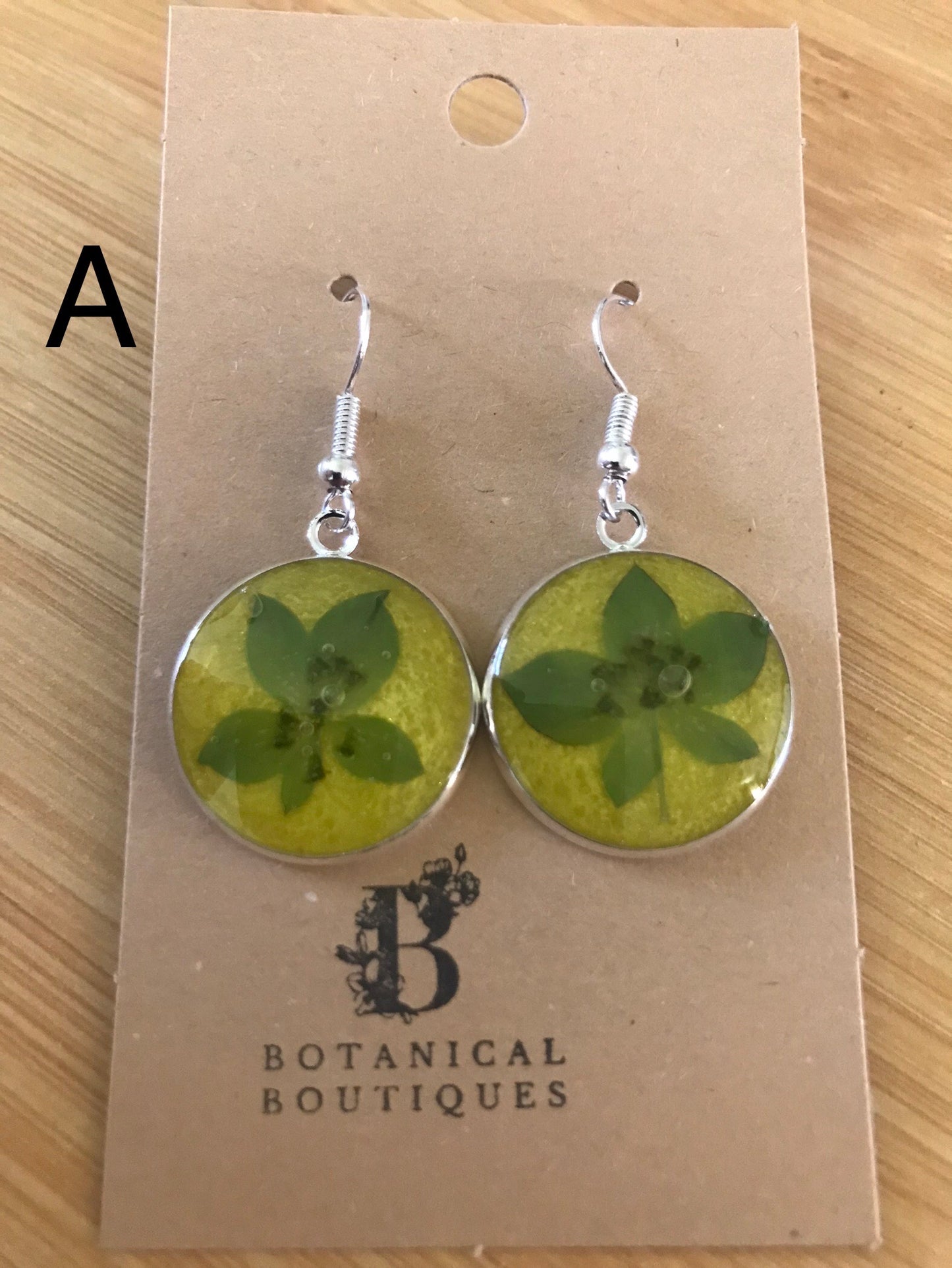 Coloured background dangling earrings