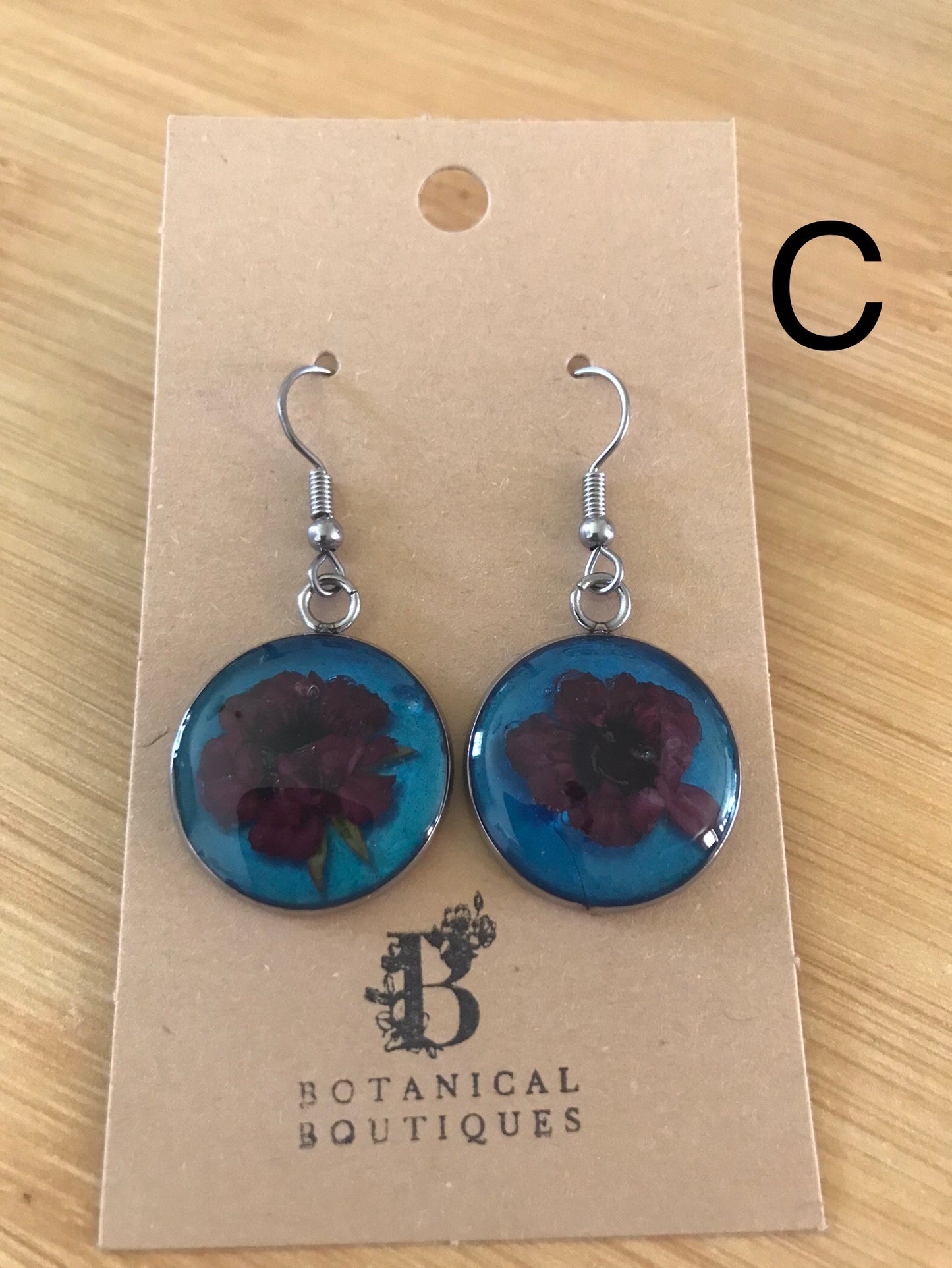 Coloured background dangling earrings
