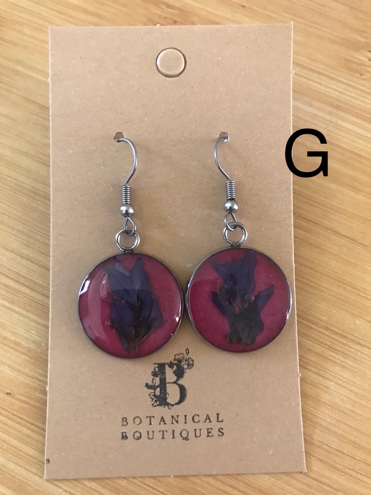 Coloured background dangling earrings